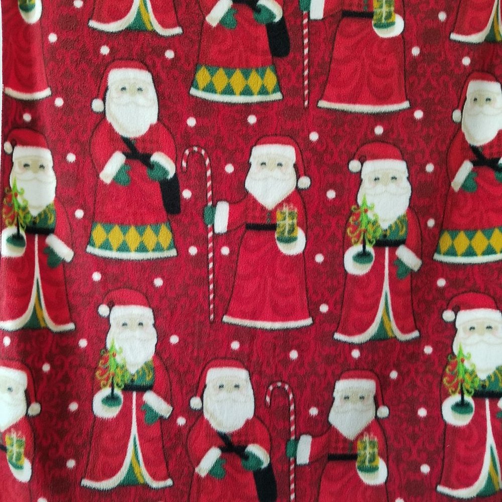 Handmade fleece baby blanket with Santa print.